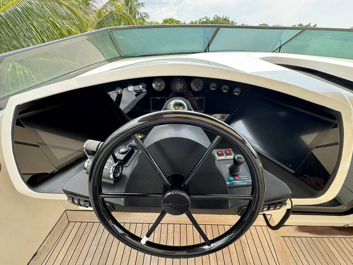 a steering wheel and dashboard of a car aboard AZIMUT 100/32 Yacht for Sale
