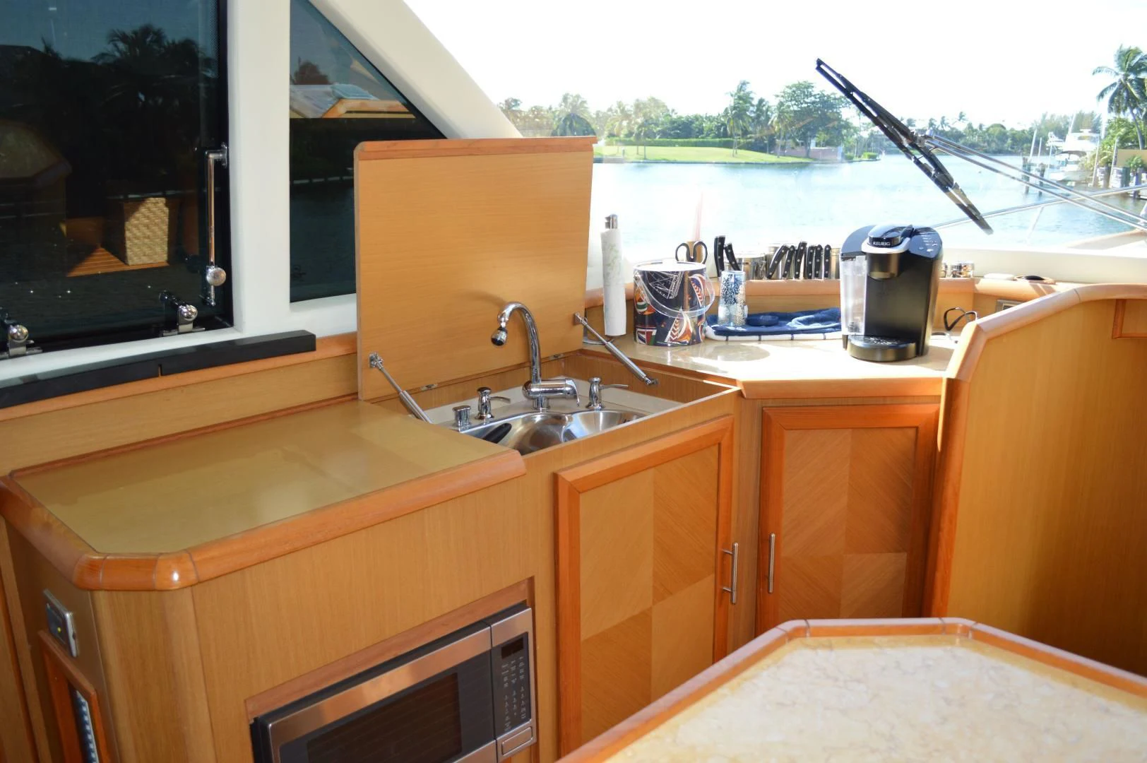 a kitchen with a sink and a window aboard KNOT NANNY'S Yacht for Sale