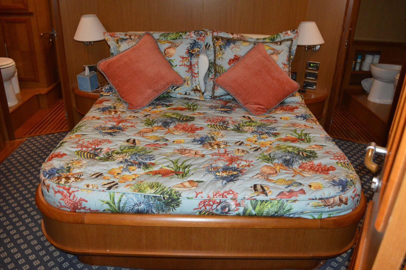 a bed with a floral comforter aboard KNOT NANNY'S Yacht for Sale