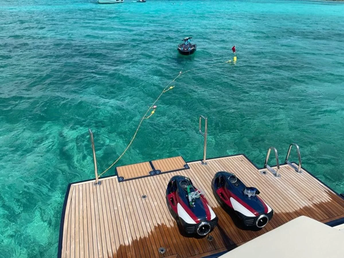 a boat with a car on it aboard KNOT NANNY'S Yacht for Sale