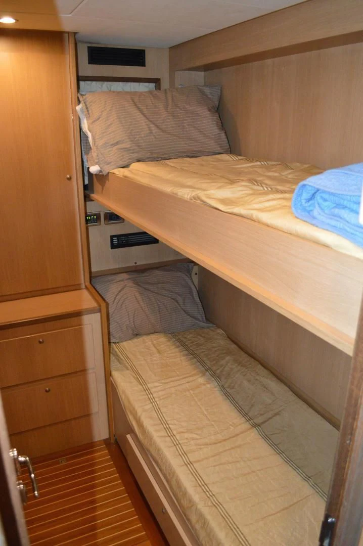a bed with a couple of beds aboard KNOT NANNY'S Yacht for Sale
