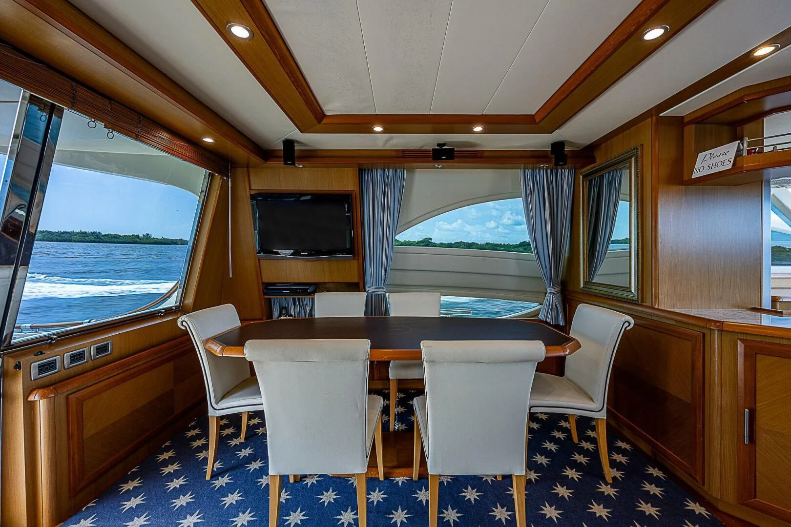 a table and chairs in a room aboard KNOT NANNY'S Yacht for Sale