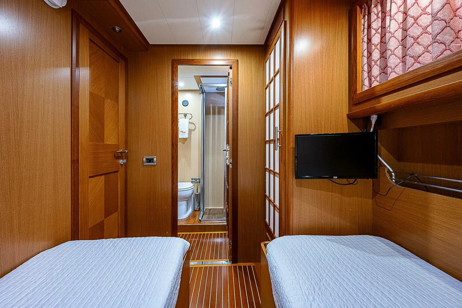 a room with a bed and a television aboard KNOT NANNY'S Yacht for Sale