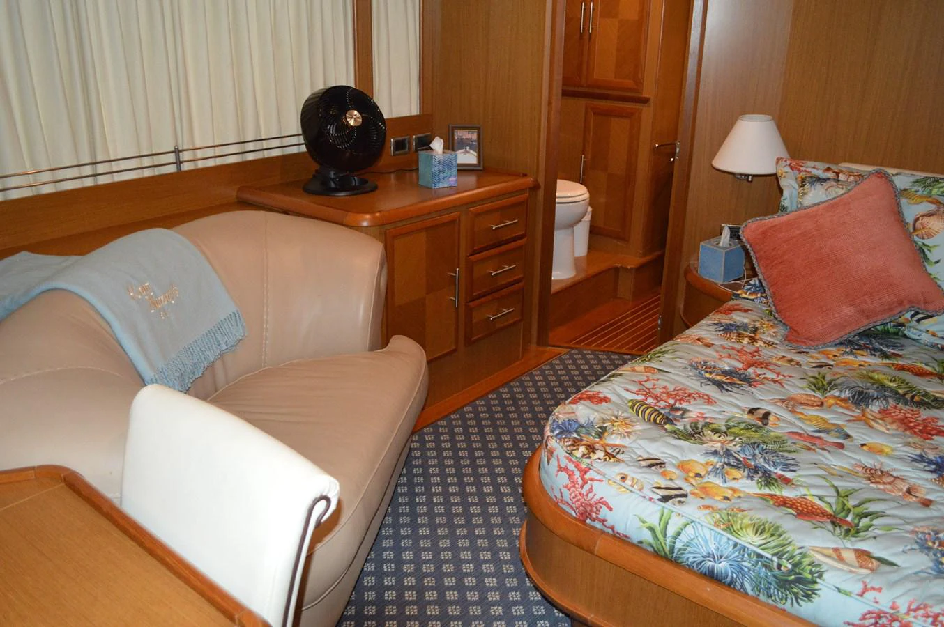 a bedroom with a bed and a desk aboard KNOT NANNY'S Yacht for Sale