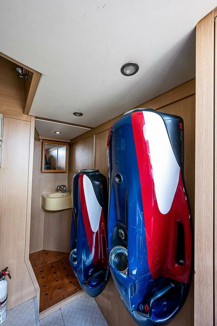 a red and black surfboard in a room aboard KNOT NANNY'S Yacht for Sale