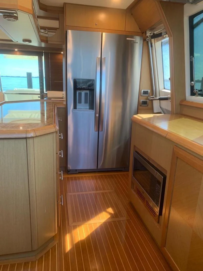 a large refrigerator in a kitchen aboard KNOT NANNY'S Yacht for Sale