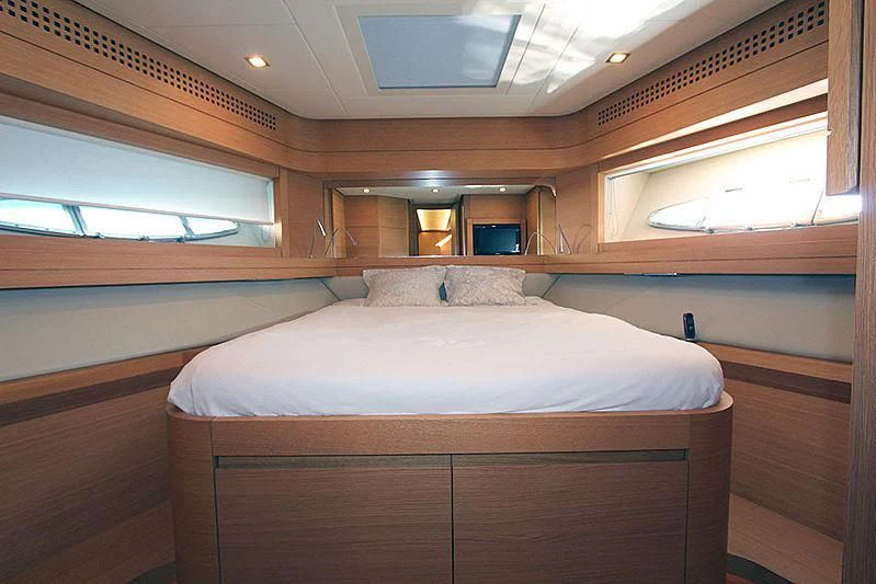a room with a bed and a window aboard WAHOO Yacht for Sale