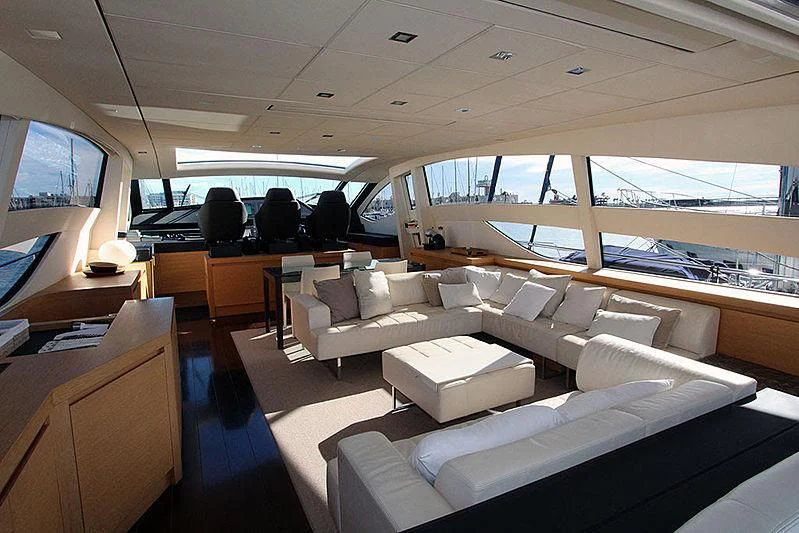 a room with couches and a tv aboard WAHOO Yacht for Sale