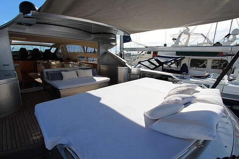 a boat with a large bed aboard WAHOO Yacht for Sale