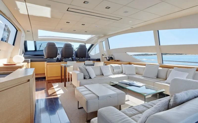 a room with a couch and a table aboard WAHOO Yacht for Sale