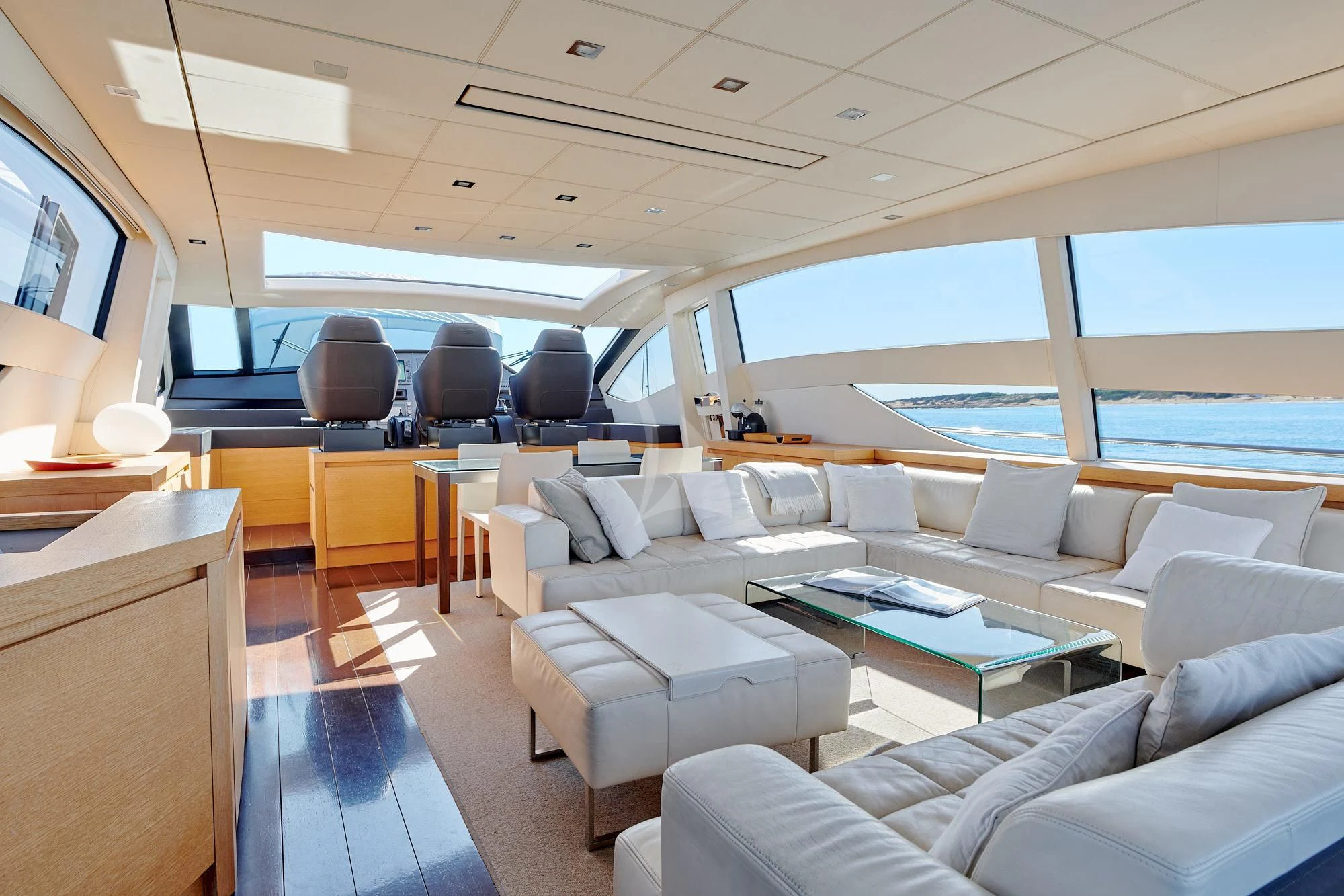 a room with a couch and a table and a television aboard WAHOO Yacht for Sale