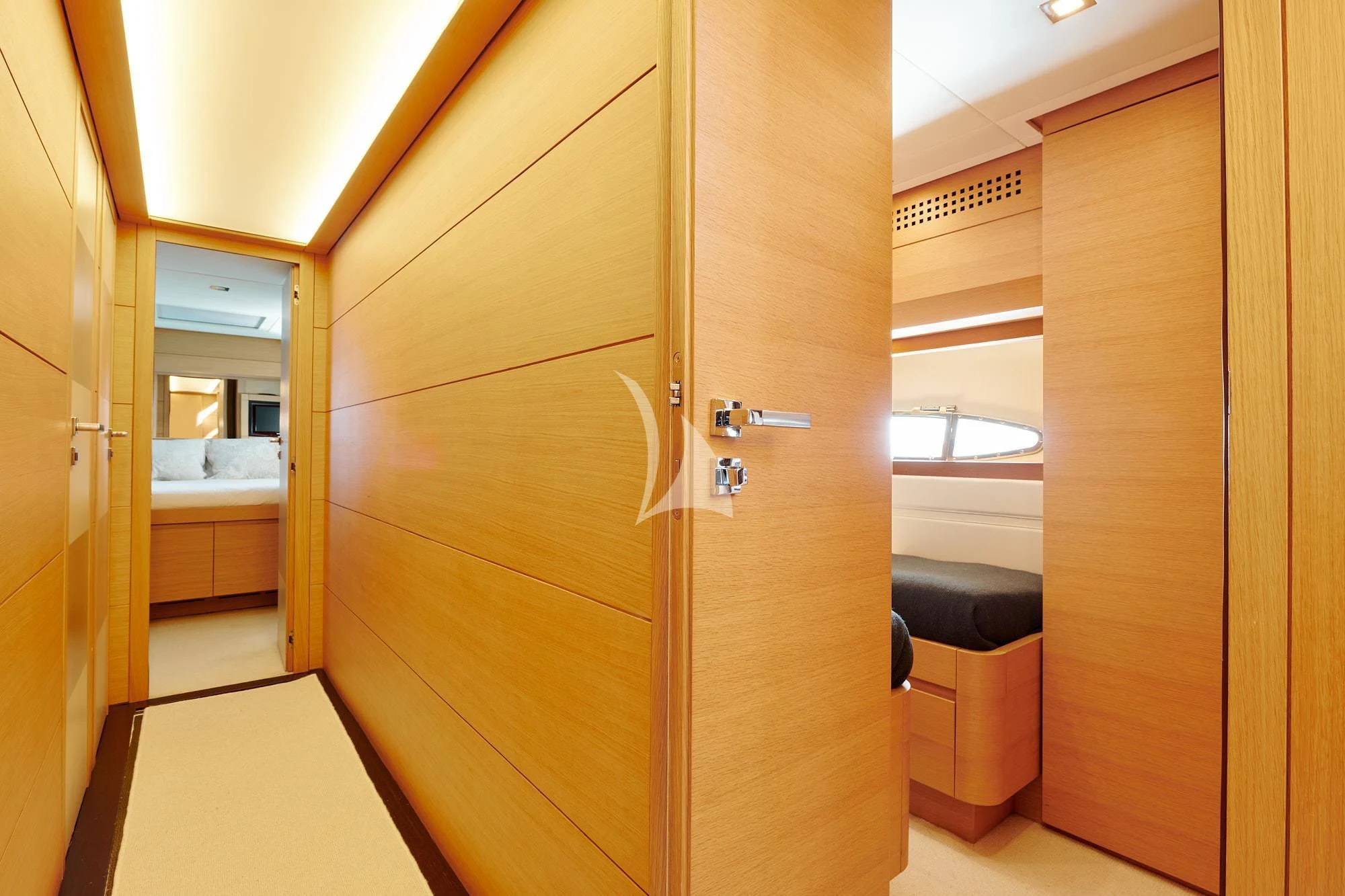 a room with a wood door and a window aboard WAHOO Yacht for Sale