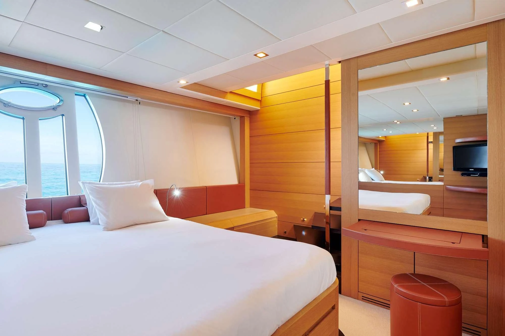 a room with a bed and a television aboard WAHOO Yacht for Sale