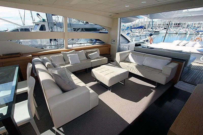 a room with a boat and a couch aboard WAHOO Yacht for Sale