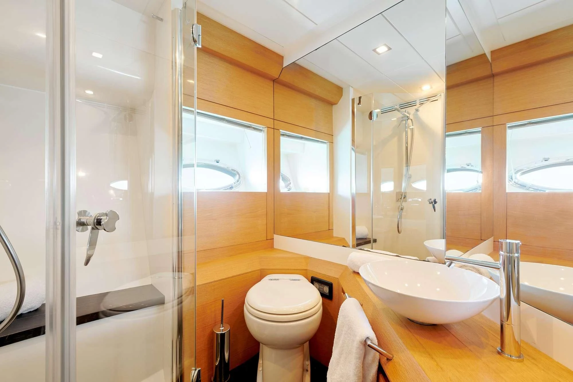 a bathroom with a glass shower aboard WAHOO Yacht for Sale