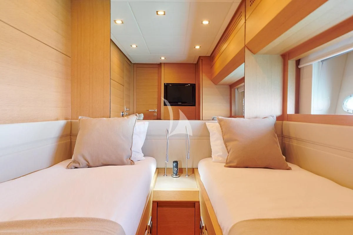 a room with a bed and a television aboard WAHOO Yacht for Sale