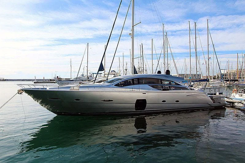 a white boat in a harbor aboard WAHOO Yacht for Sale