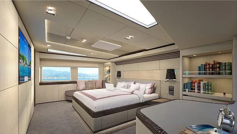 a room with a bed and a desk aboard HARMONY Yacht for Sale