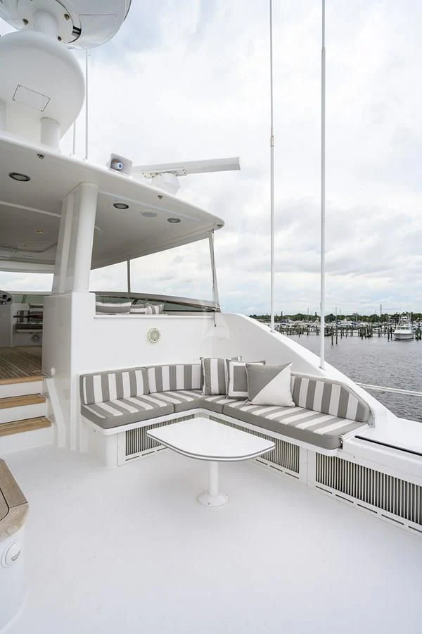 a room with a table and chairs aboard UNWINED Yacht for Charter