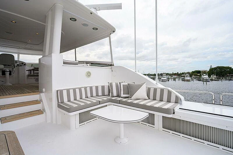 a white lounge chair on a boat aboard UNWINED Yacht for Charter