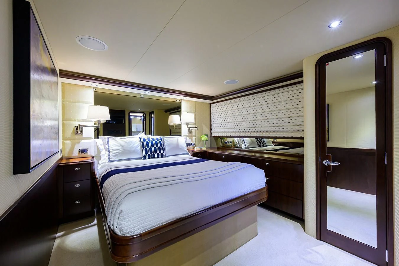 a bedroom with a large bed aboard UNWINED Yacht for Charter