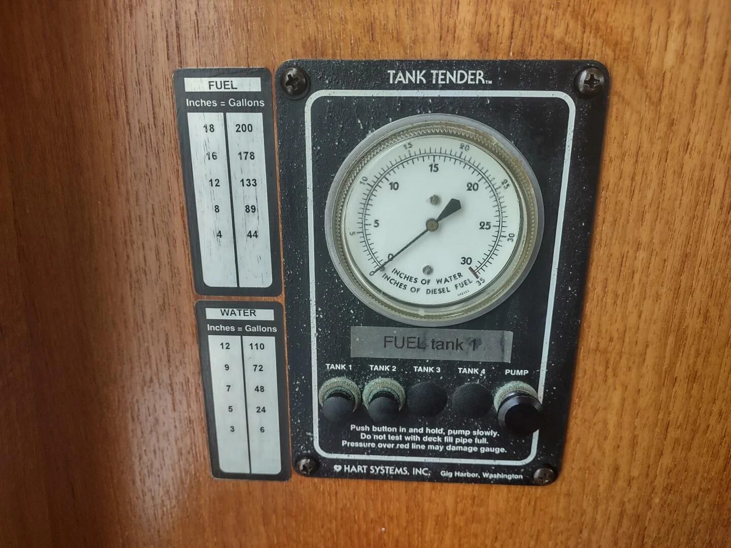 a rectangular object with a clock on it aboard UNWINED Yacht for Charter