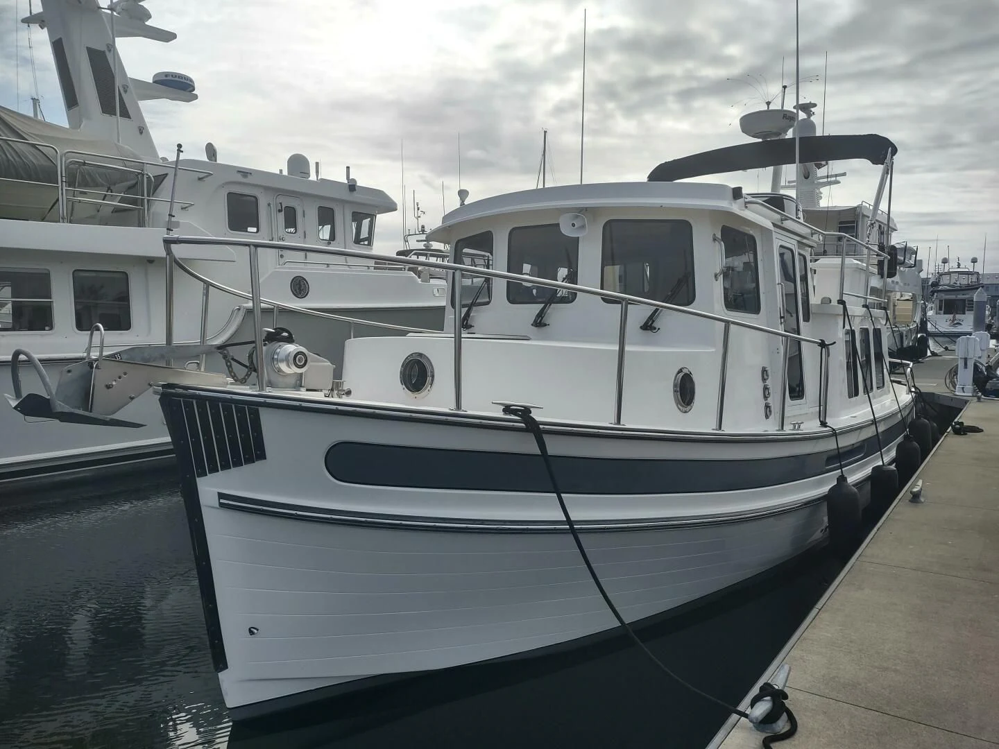 a boat docked at a pier aboard UNWINED Yacht for Charter