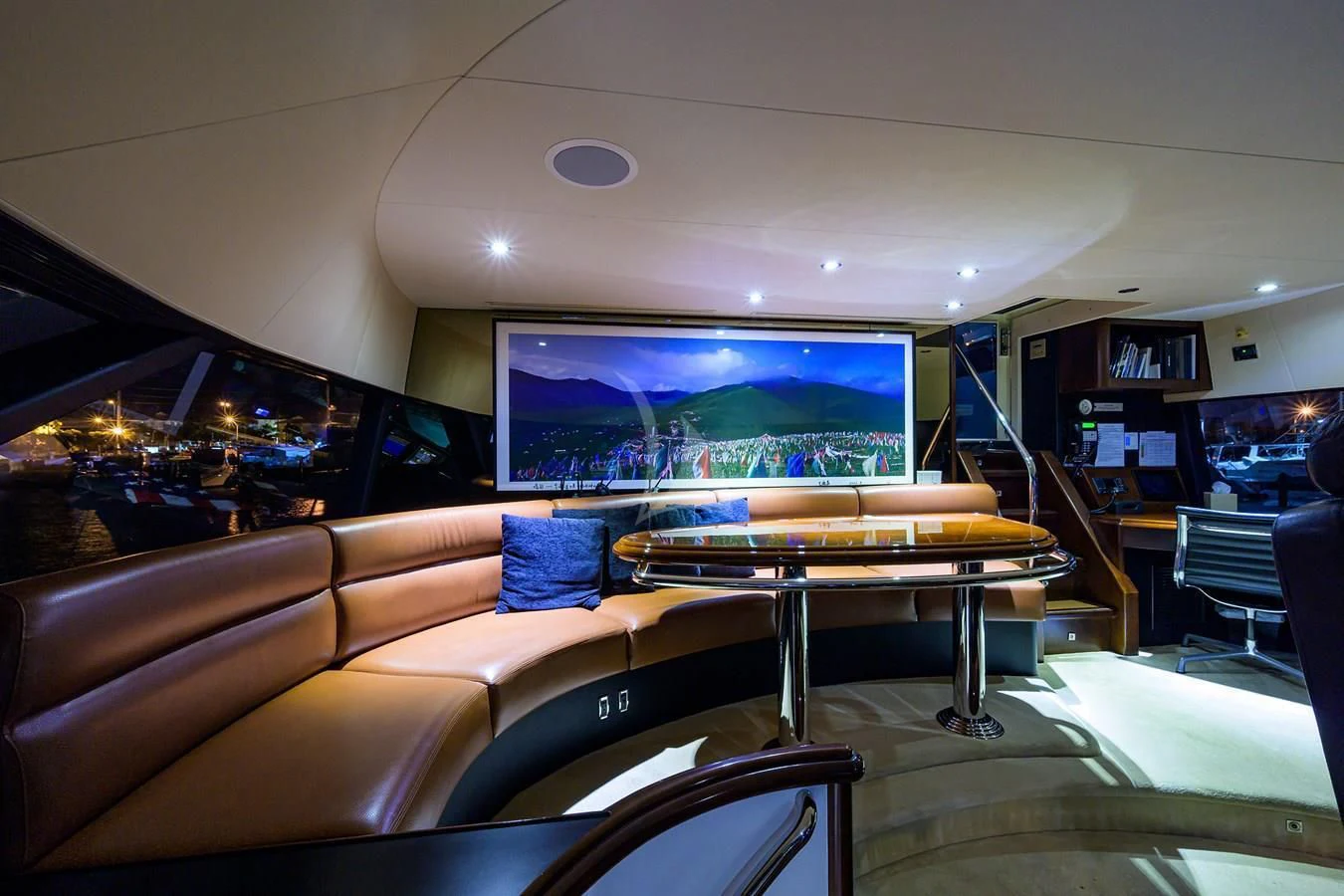 a living room with a large screen aboard UNWINED Yacht for Charter