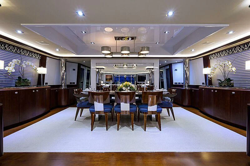 a large room with a table and chairs aboard UNWINED Yacht for Charter
