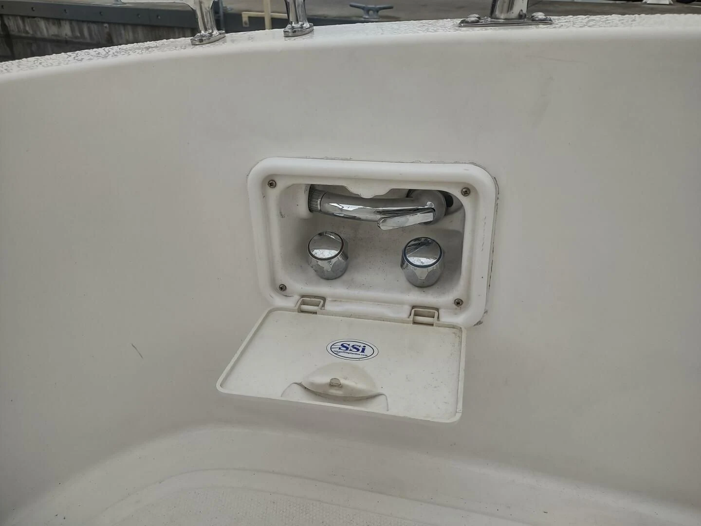 a white car door aboard UNWINED Yacht for Charter