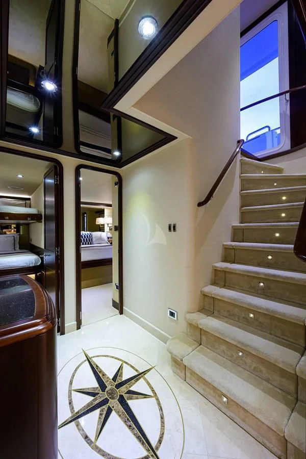 a staircase with a bicycle aboard UNWINED Yacht for Charter
