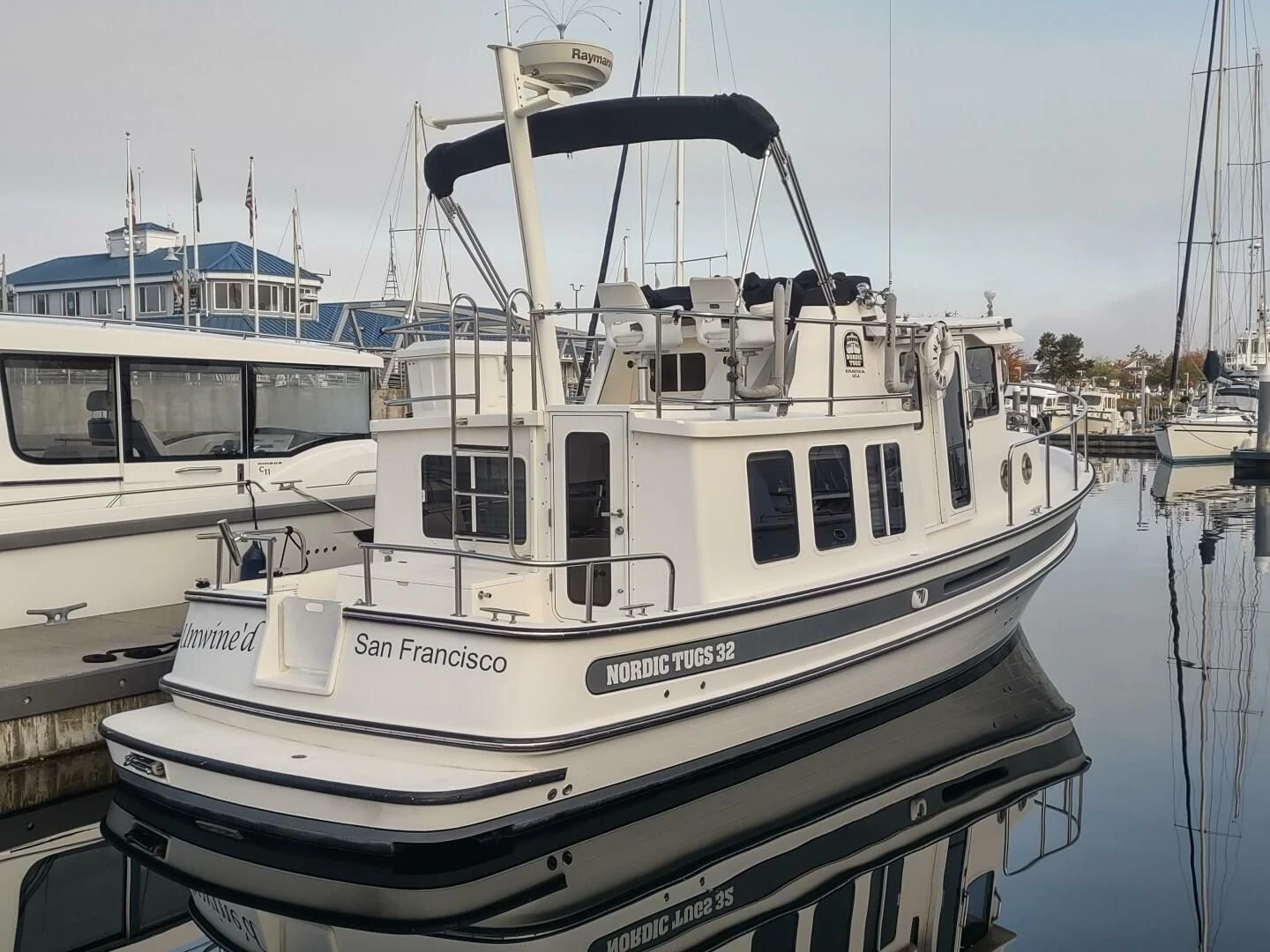 a boat docked at a pier aboard UNWINED Yacht for Charter