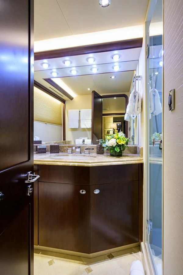 a bathroom with a large mirror aboard UNWINED Yacht for Charter