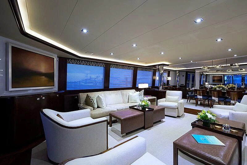 a living room with a large screen aboard UNWINED Yacht for Charter