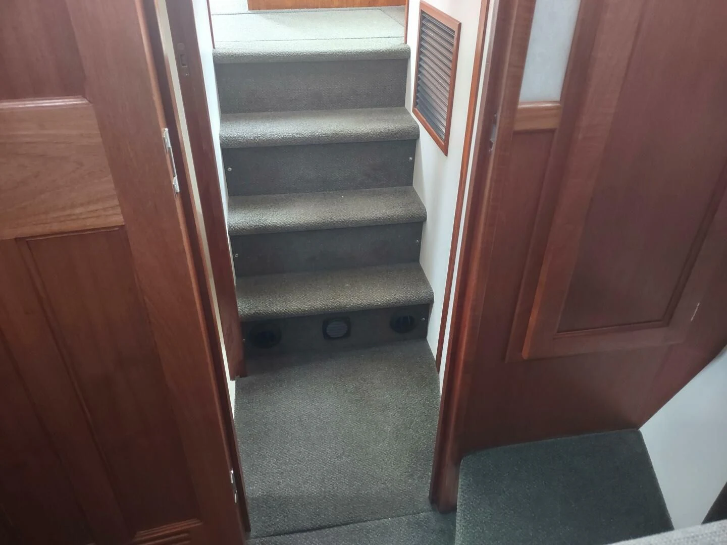 a door with a vent aboard UNWINED Yacht for Charter