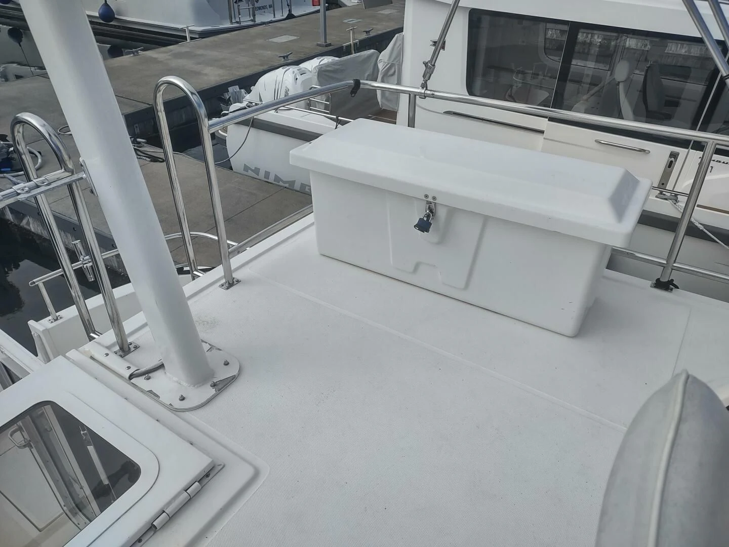 a white rectangular object with a metal frame on a white surface aboard UNWINED Yacht for Charter