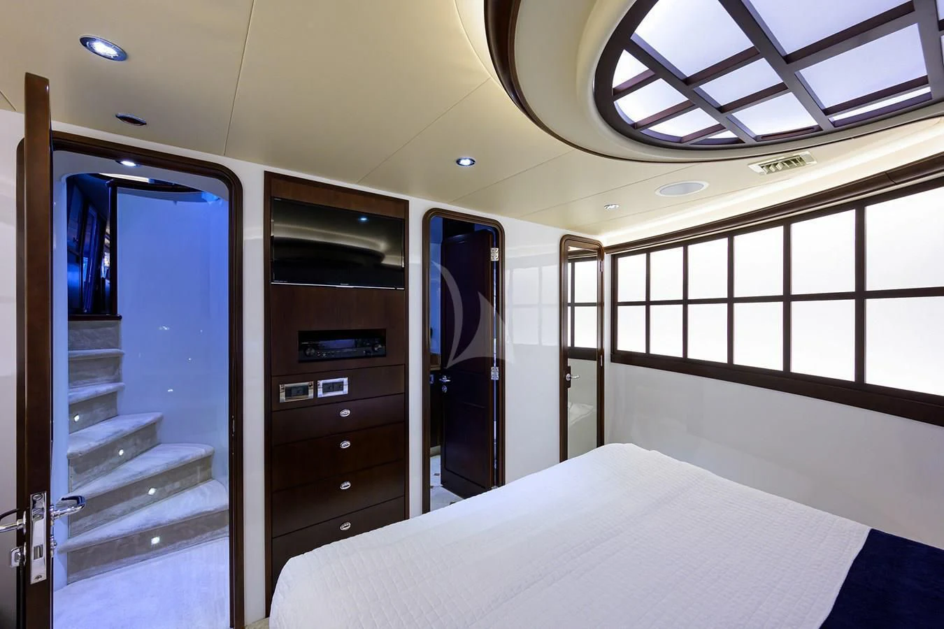a room with a bed and a closet aboard UNWINED Yacht for Charter