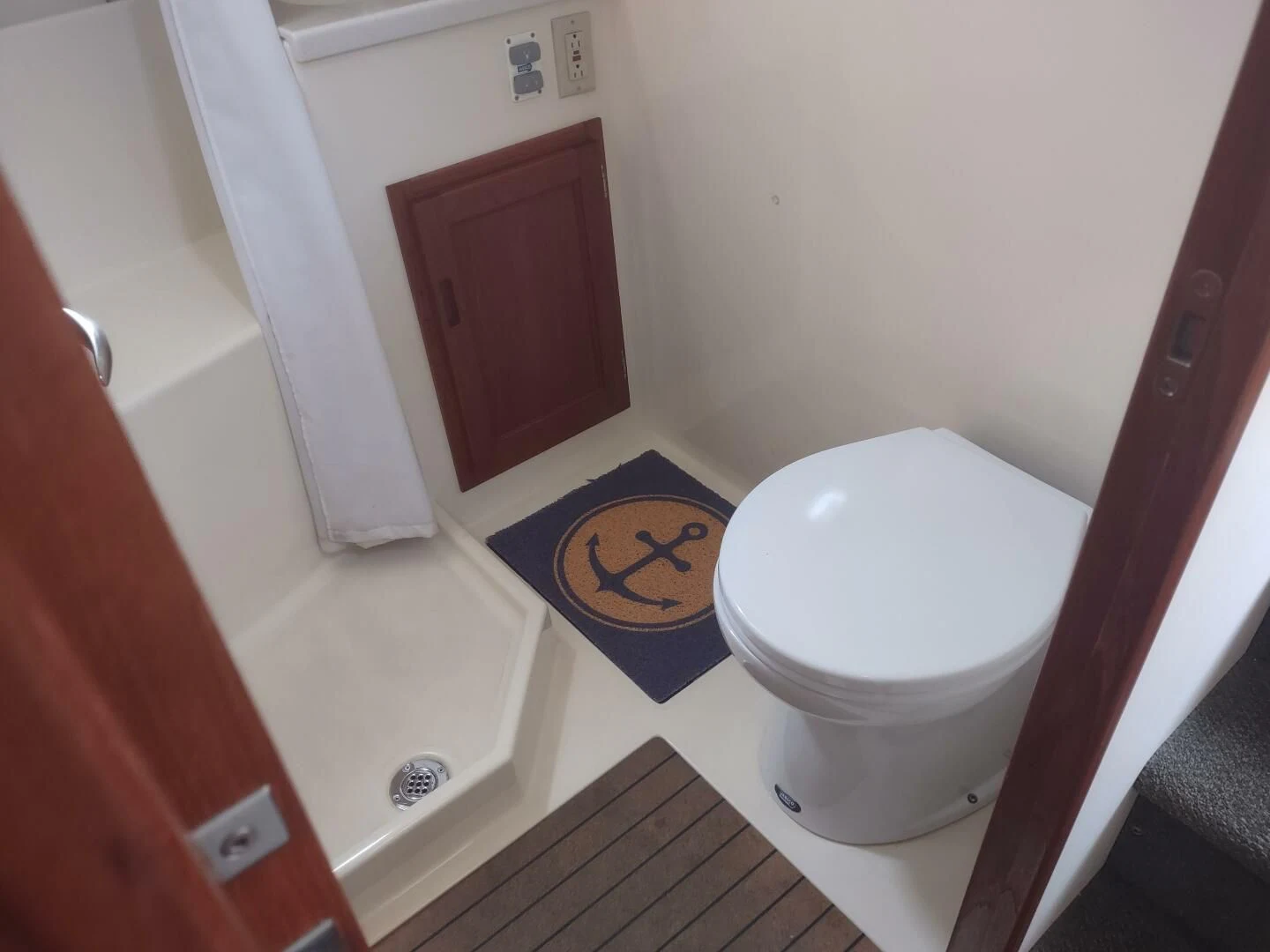 a bathroom with a toilet aboard UNWINED Yacht for Charter