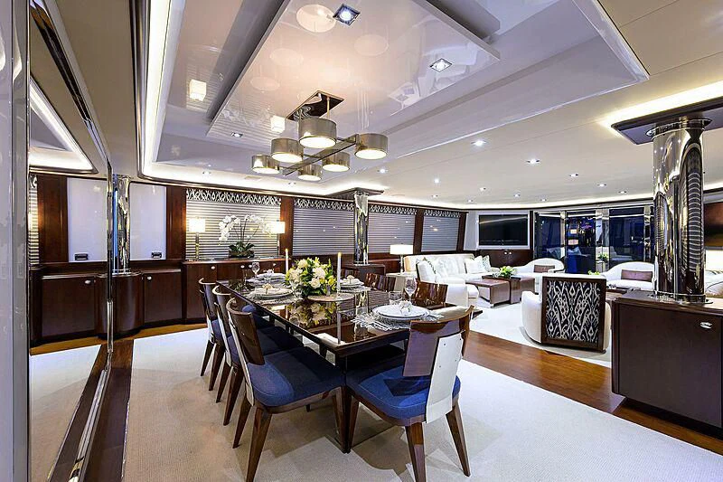 a large dining room with a large table and chairs aboard UNWINED Yacht for Charter