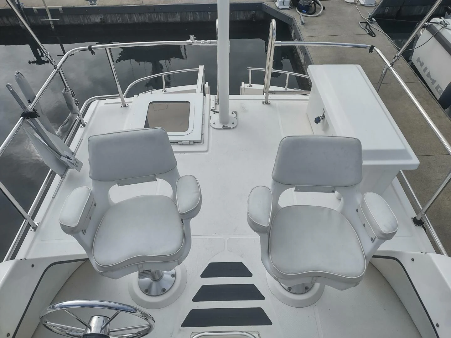 a group of chairs in a room aboard UNWINED Yacht for Charter