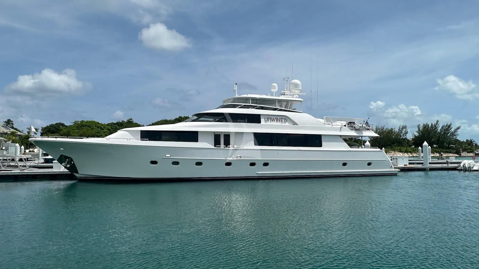 a white yacht in the water aboard UNWINED Yacht for Charter