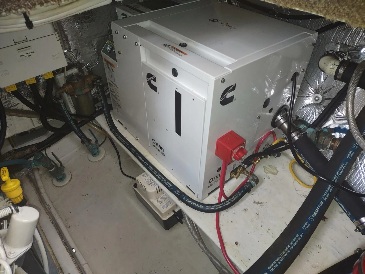 a white machine with wires aboard UNWINED Yacht for Charter