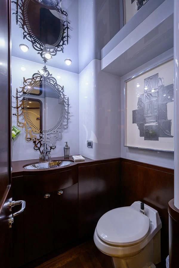 a bathroom with a sink and a mirror aboard UNWINED Yacht for Charter