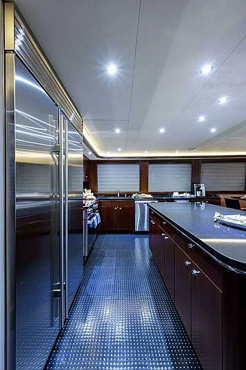 a large kitchen with a large glass door aboard UNWINED Yacht for Charter