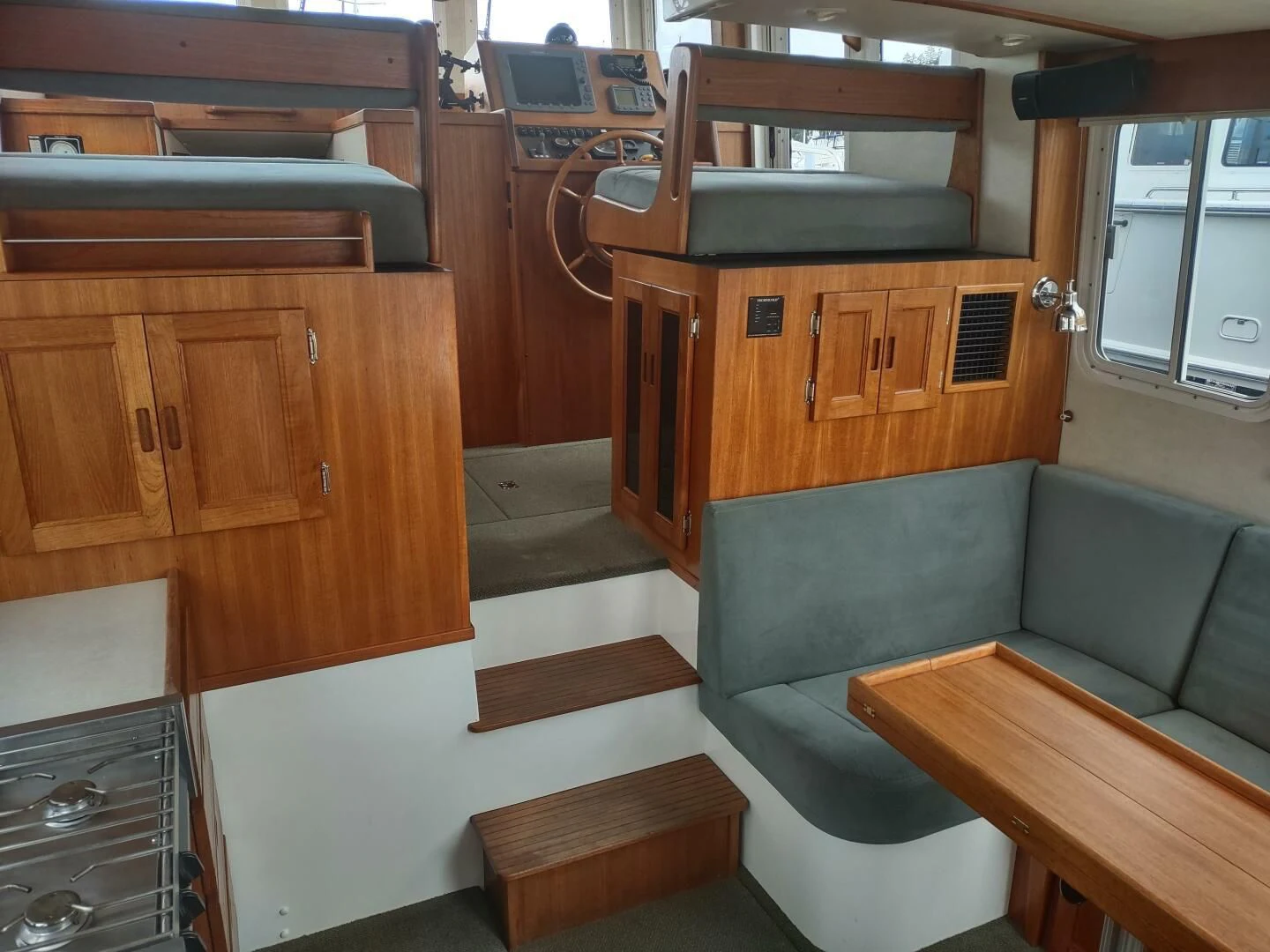 a room with a couch and a table aboard UNWINED Yacht for Charter