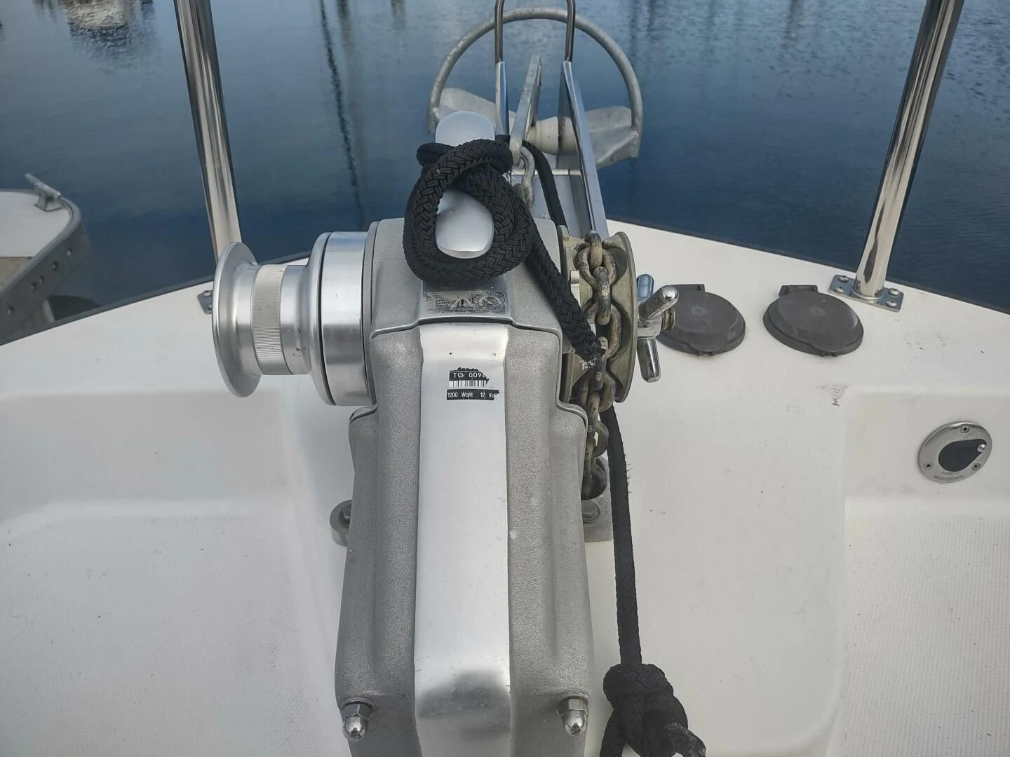 a white machine with a black handle aboard UNWINED Yacht for Charter
