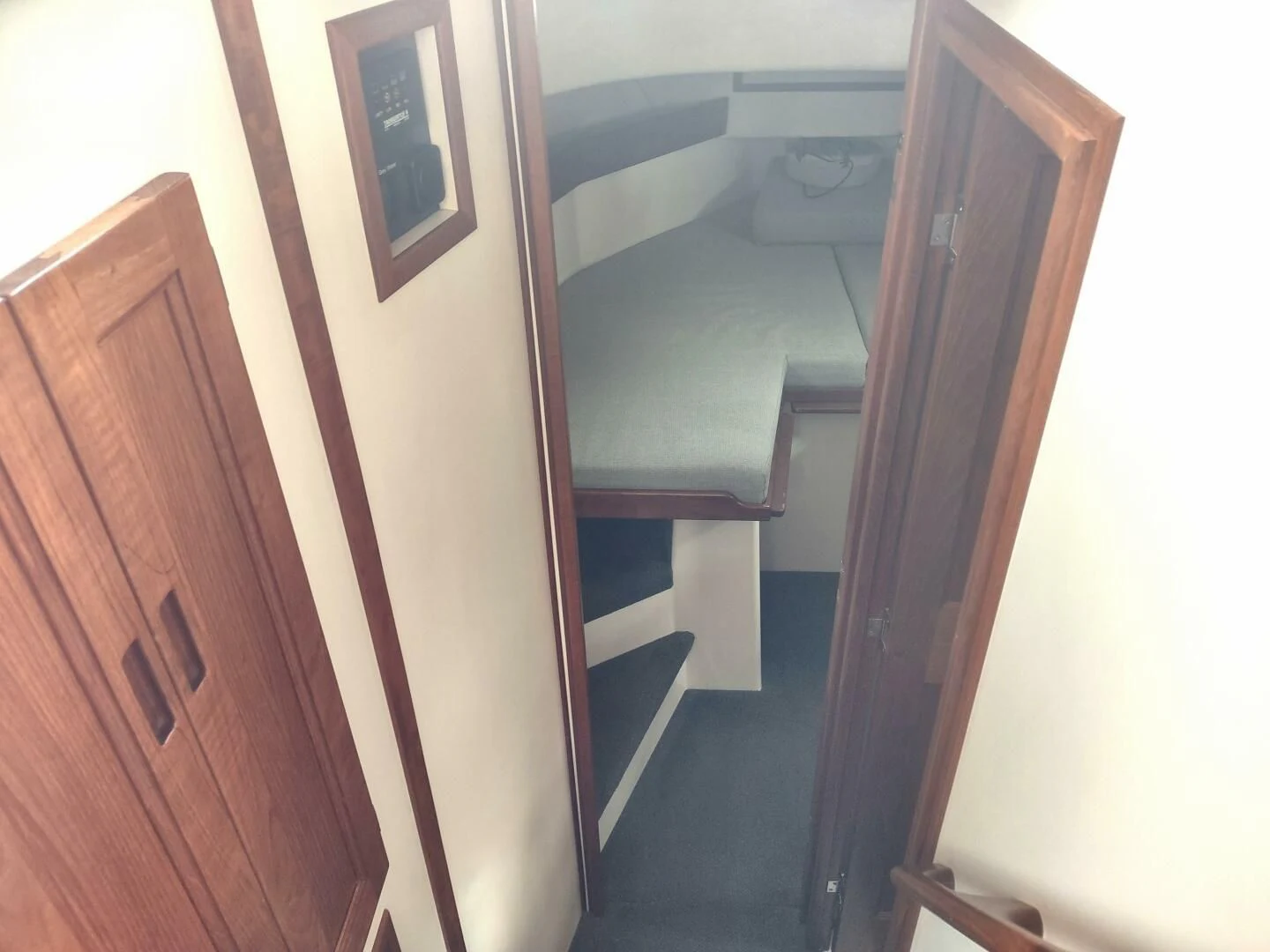 a bathroom with a sink and a mirror aboard UNWINED Yacht for Charter