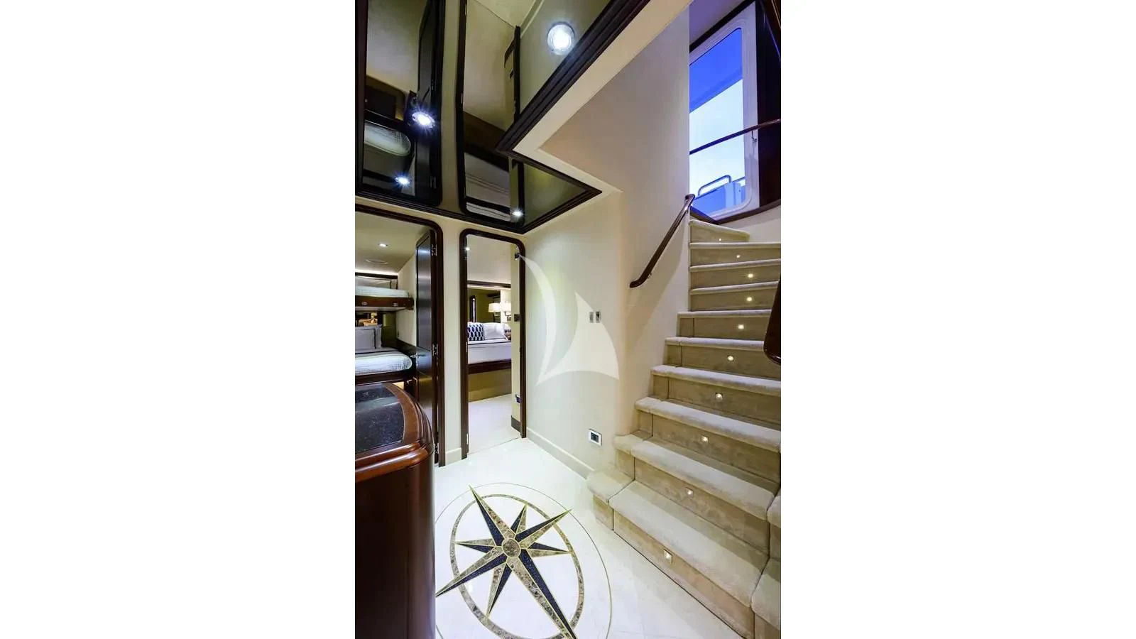 a staircase with a cart aboard UNWINED Yacht for Charter