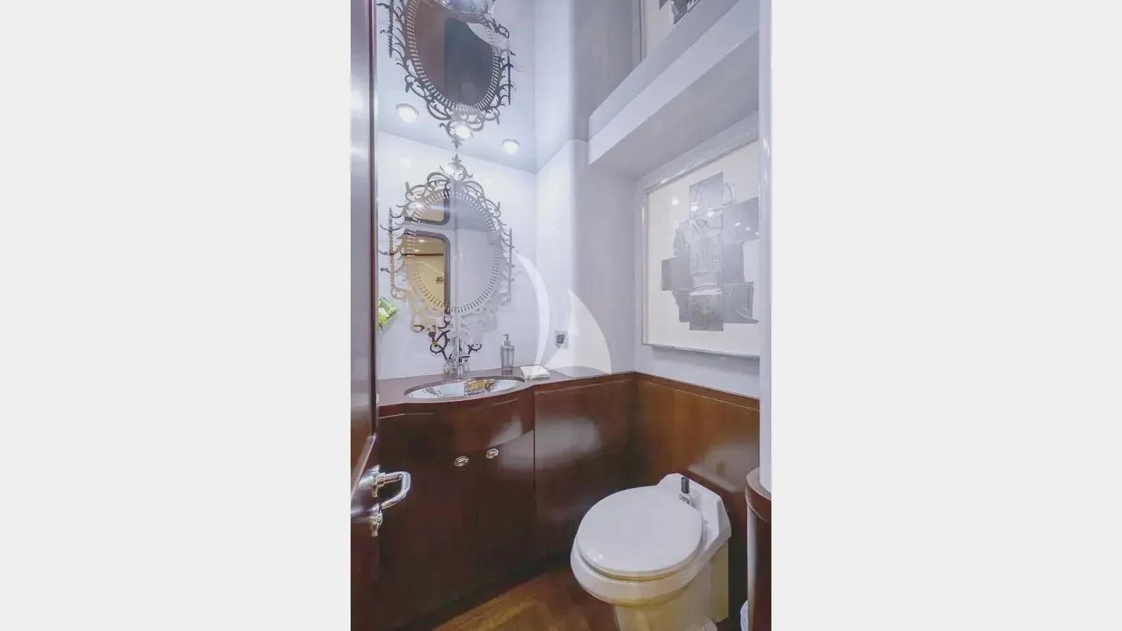 a bathroom with a sink and a toilet aboard UNWINED Yacht for Charter