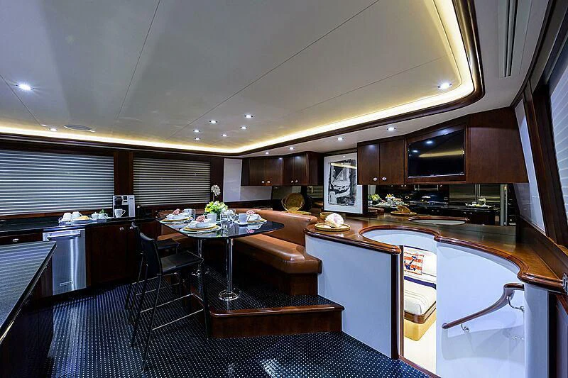 a kitchen and dining area aboard UNWINED Yacht for Charter
